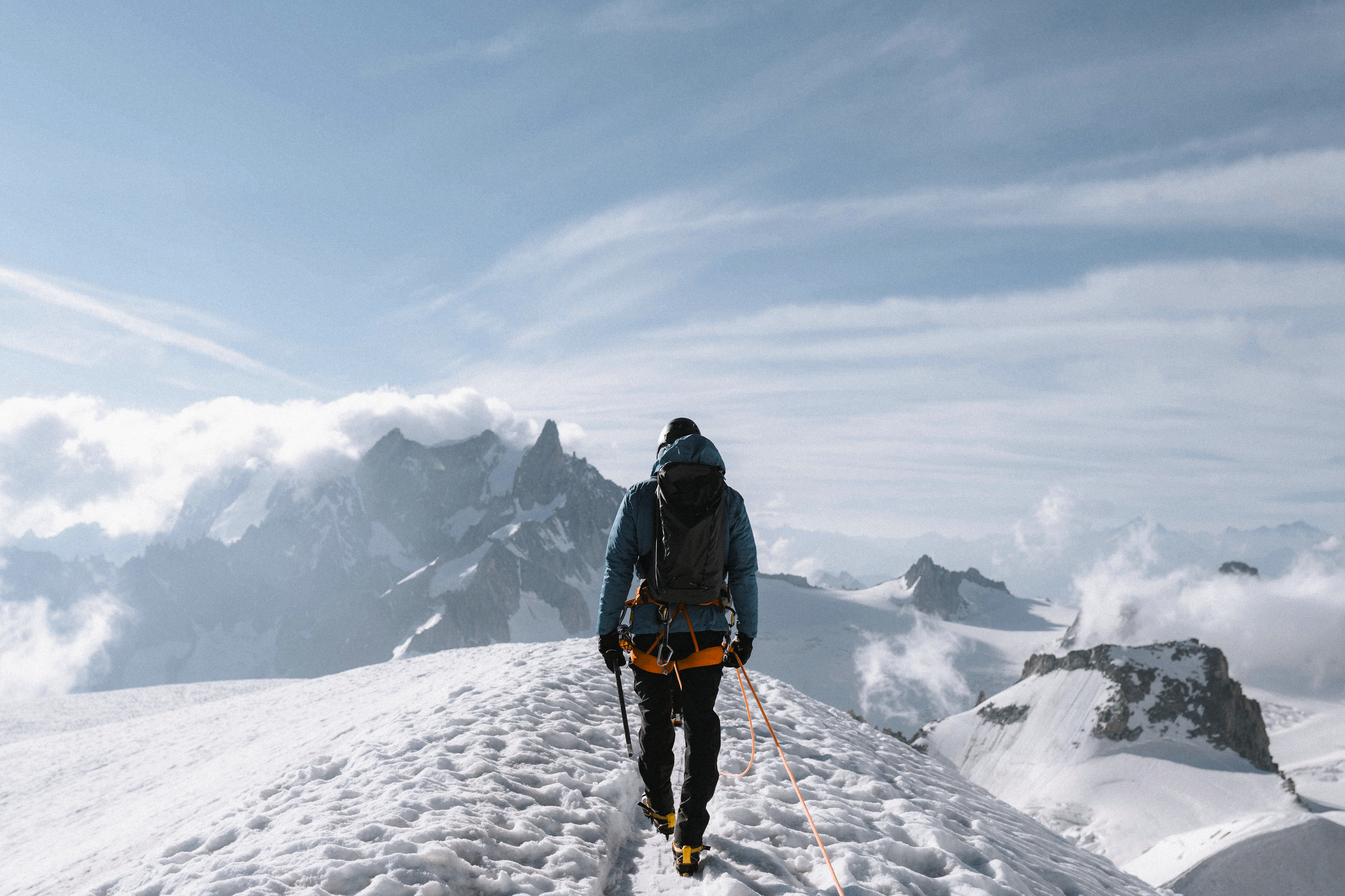 Man walking on snow-covered mountain
